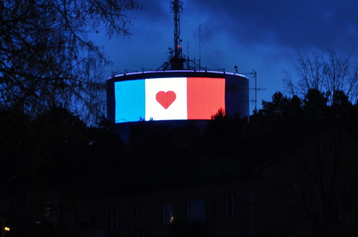 Swedish building lit up in French colours